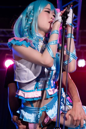 Japanese cosplayer Ria Kurumi sings on music stage while getting fucked from behind